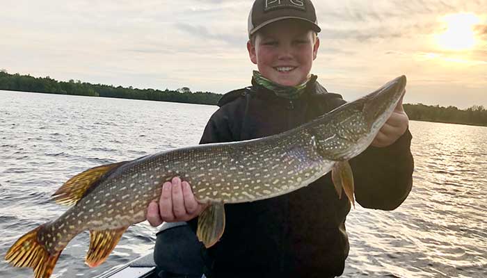 Kid with pike caught in Hayward